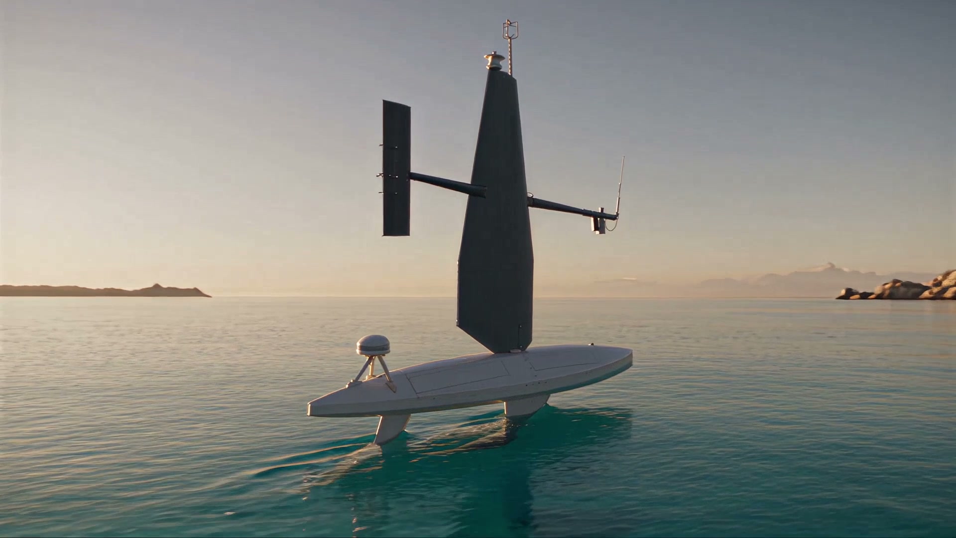 The sail drone sailing away from a rocky coast at golden hour