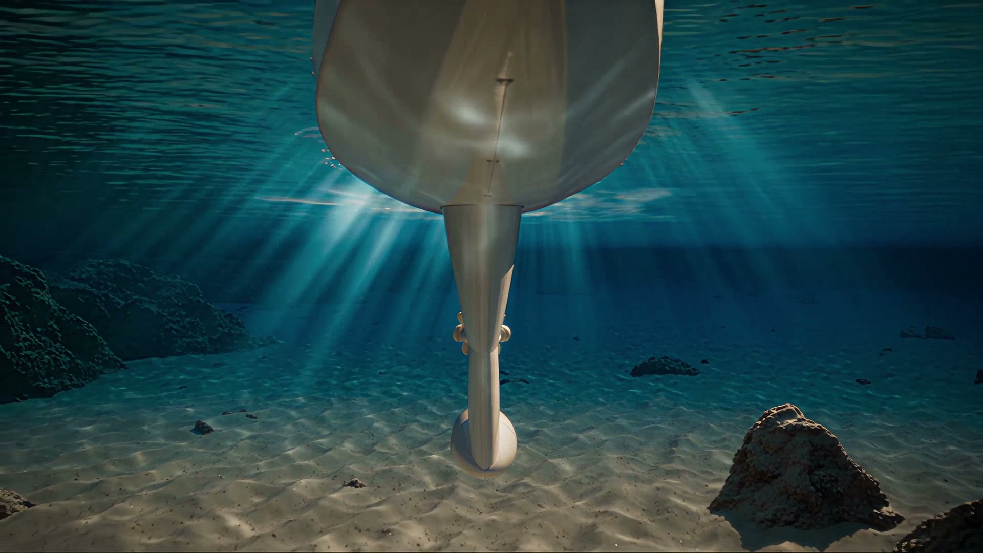 The keel pod seen from under water, sunlight rays on the sandy seabed