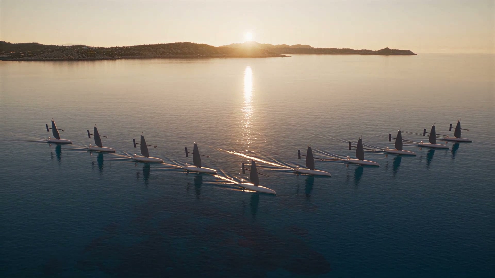 A dozen sail drones at anchor at sunset, seen from above