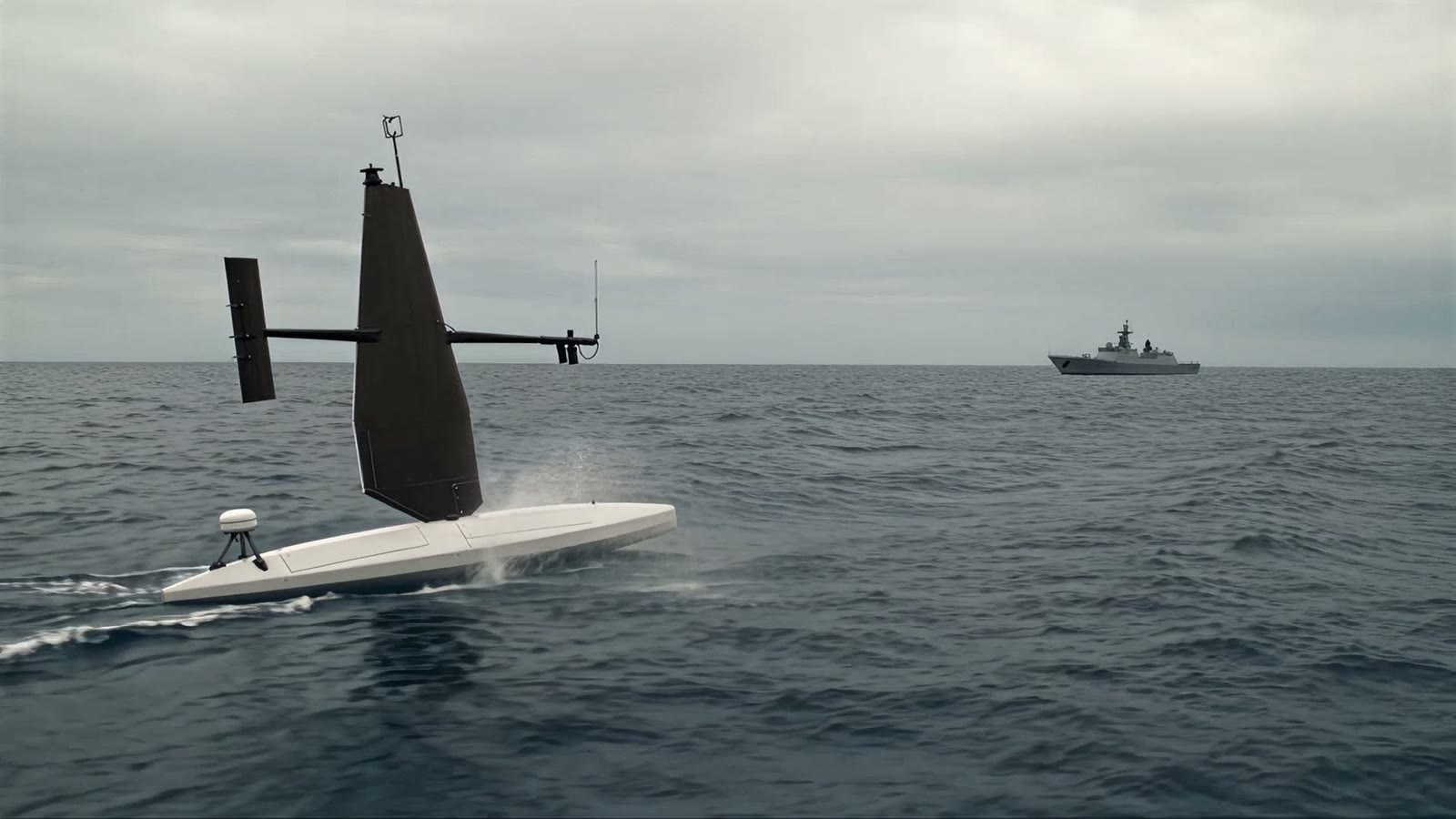 The sail drone at sea with a frigate on the horizon